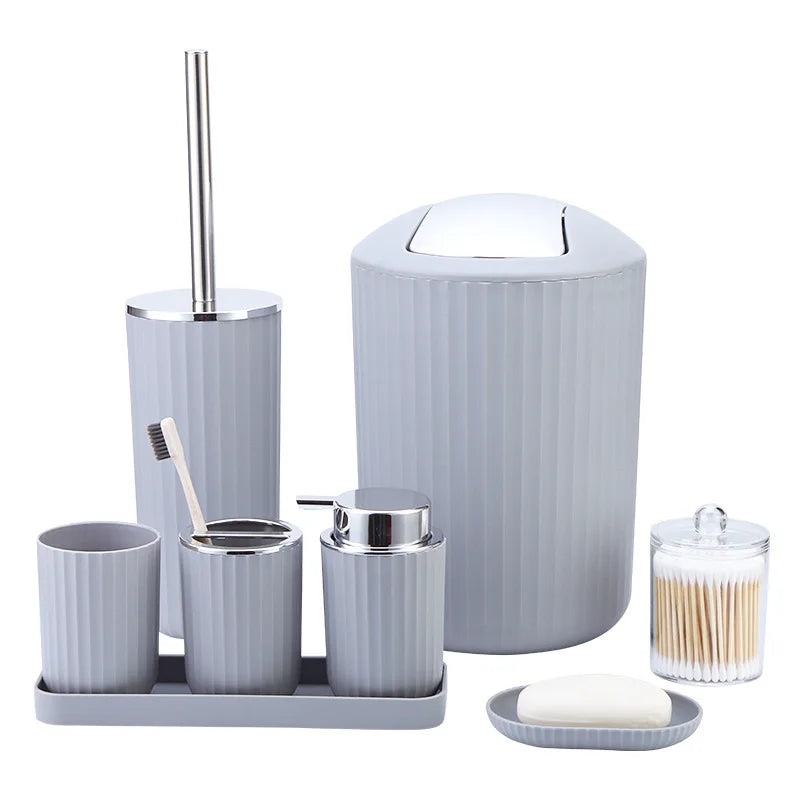 Gray bathroom accessory set with various items on a white background